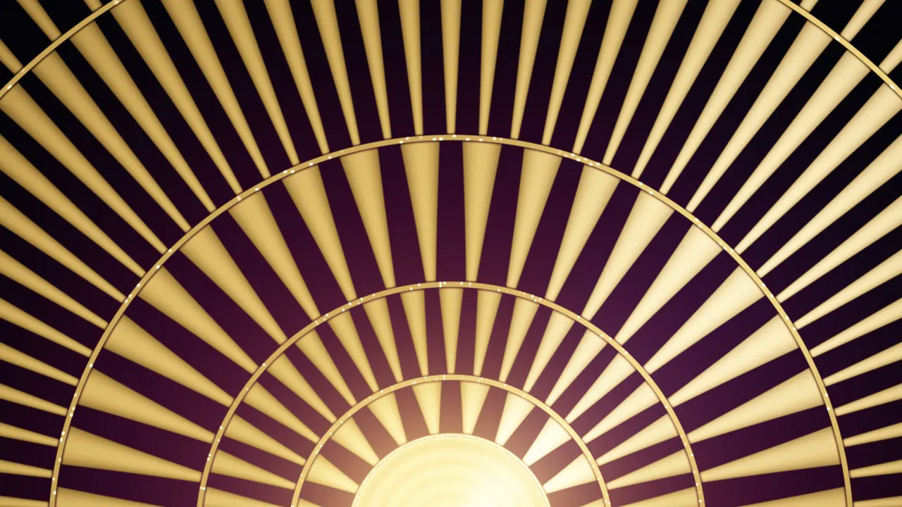 A gold art-deco sunburst fan on black lacquer